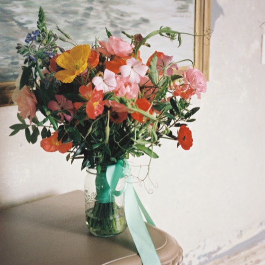 Bridal bouquet in vase with ribbon