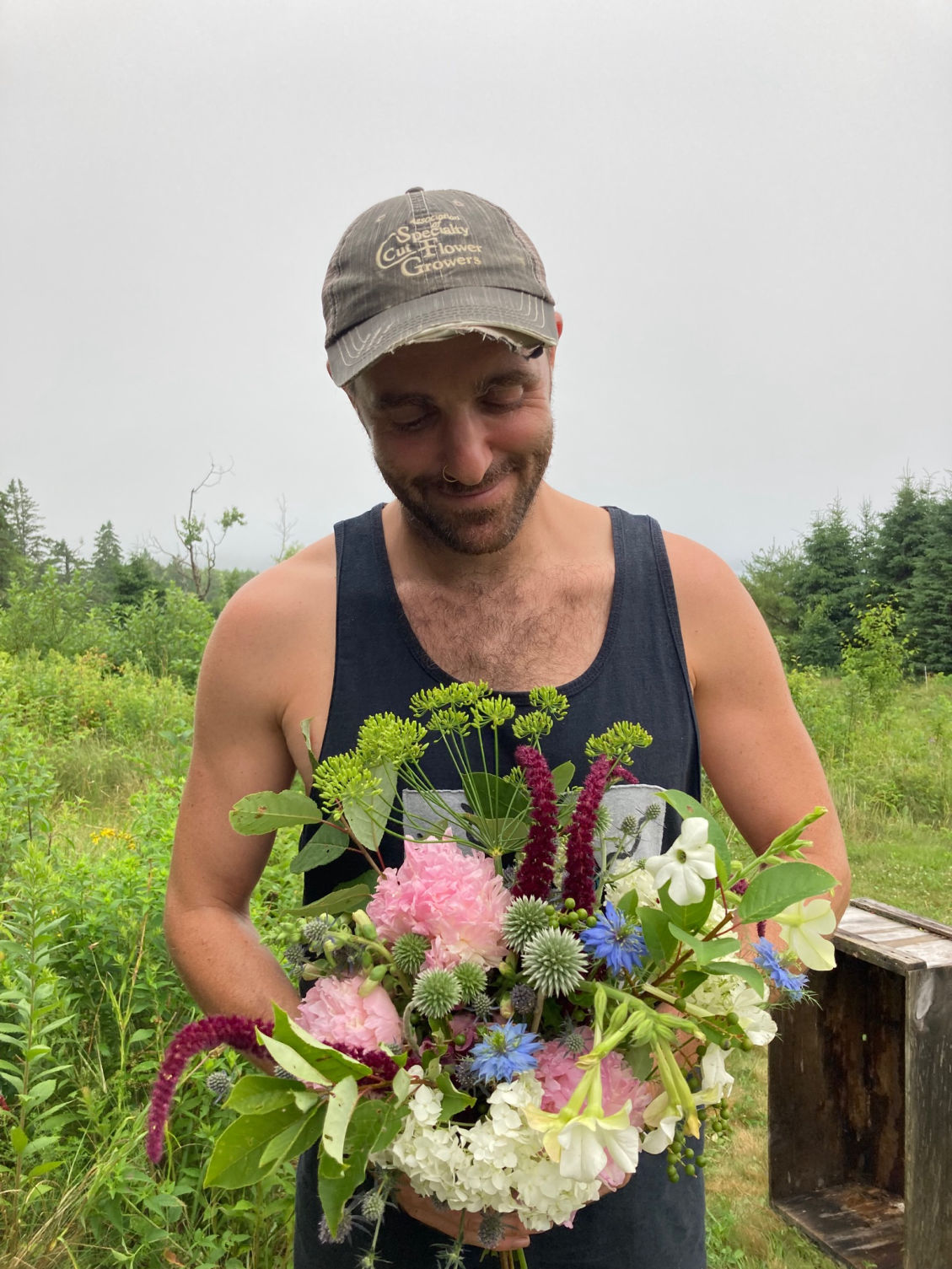 Chris holding flowers